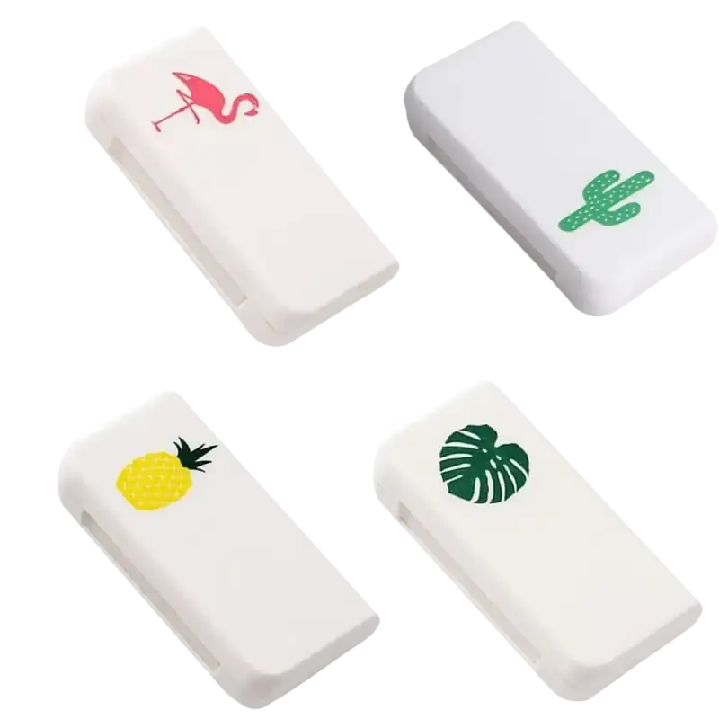 Four white, rectangular, decorated erasers.