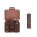 Brown pill organizer with size dimensions.