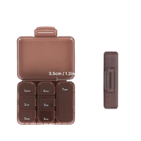 Brown pill organizer with size dimensions.