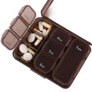 Brown pill organizer with daily compartments.