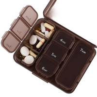 Brown pill organizer with daily compartments.