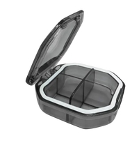 Open gray pill organizer with dimensions.