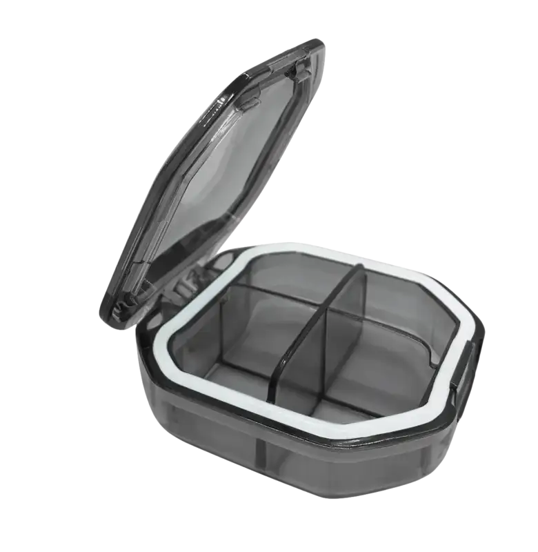 Open gray pill organizer with dimensions.