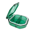 Green plastic pill organizer with four compartments.