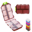 Maroon plastic pill organizer.