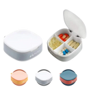 Square pill organizer with four compartments.