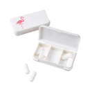 White pill organizer with flamingo design.
