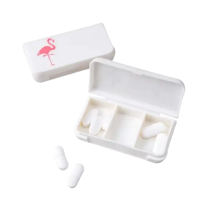 White pill organizer with flamingo design.