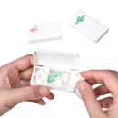White pill organizer with flamingo and cactus designs.