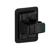 Black plastic shower head holder.