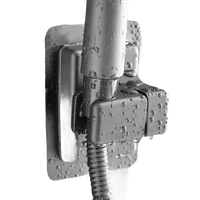 Chrome shower head holder with water droplets.