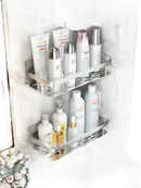 Two-tiered bathroom shelves with toiletries.
