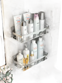 Two-tiered bathroom shelves with toiletries.