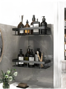 Two-tiered black bathroom shelves.