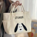 Cream-colored canvas tote bag with Snoopy design.