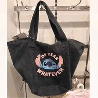 Gray tote bag with Stitch graphic.
