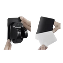 Black shower head holder with adhesive backing.