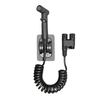 Gun grey bidet sprayer with coiled hose.