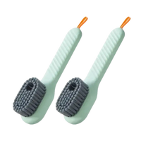 Two green cleaning brushes.