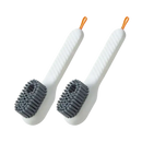 Two white cleaning brushes.