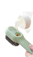 Green cleaning brush with refillable reservoir.