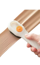 Soft bristle clothing brush.