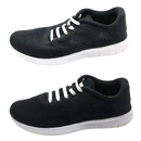 Black running shoe with white laces.