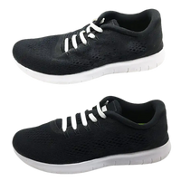 Black running shoe with white laces.