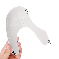 Shoe shield inserts with cut lines.