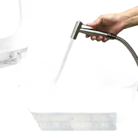 Handheld bidet sprayer.