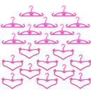 Pink plastic doll clothes hangers.