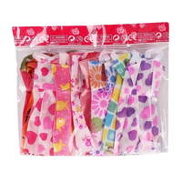 Packaged doll dresses.