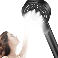 Black handheld shower head.