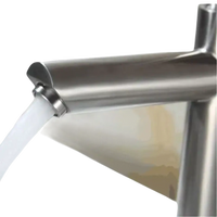 Brushed metal faucet with running water.