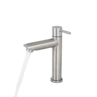 Brushed nickel bathroom faucet with running water.