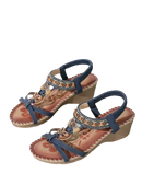 Pair of blue wedge sandals.