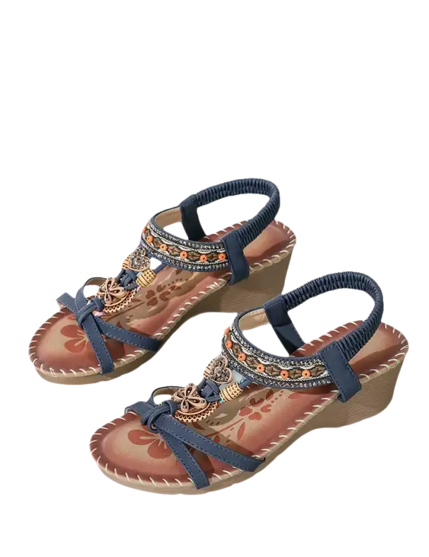 Pair of blue wedge sandals.