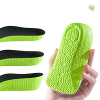 Green shoe inserts with varying thicknesses.