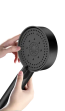 Black handheld rain shower head.