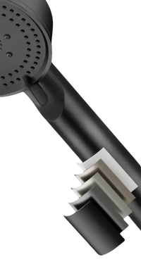 Black shower head with multiple paint layers.