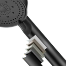 Black shower head with multiple paint layers.