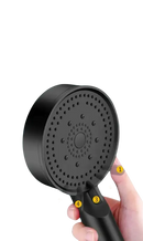 Black shower head with multiple water outlets.