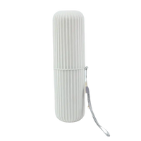 Ridged cylindrical toothbrush holder with lanyard from Vertibrush Travel Kit for on-the-go brushing