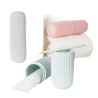 Pastel toothbrush and toothpaste containers in Vertibrush Travel Kit for on-the-go freshening