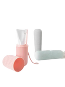 Pastel-colored toothbrush and toothpaste containers in Vertibrush Travel Kit for on-the-go brushing