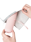 Pink ribbed travel container from Vertibrush Travel Kit with trendy vertibrush detangling hairbrush