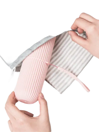 Pink ribbed travel container from Vertibrush Travel Kit with trendy vertibrush detangling hairbrush