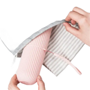 Pink ribbed water bottle in gray drawstring bag with Vertibrush Travel Kit and detangling hairbrush for trendy travel vibes