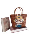 Brown woven tote bag with cartoon patch.