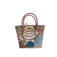 Woven tote bag with cartoon rabbit patch.